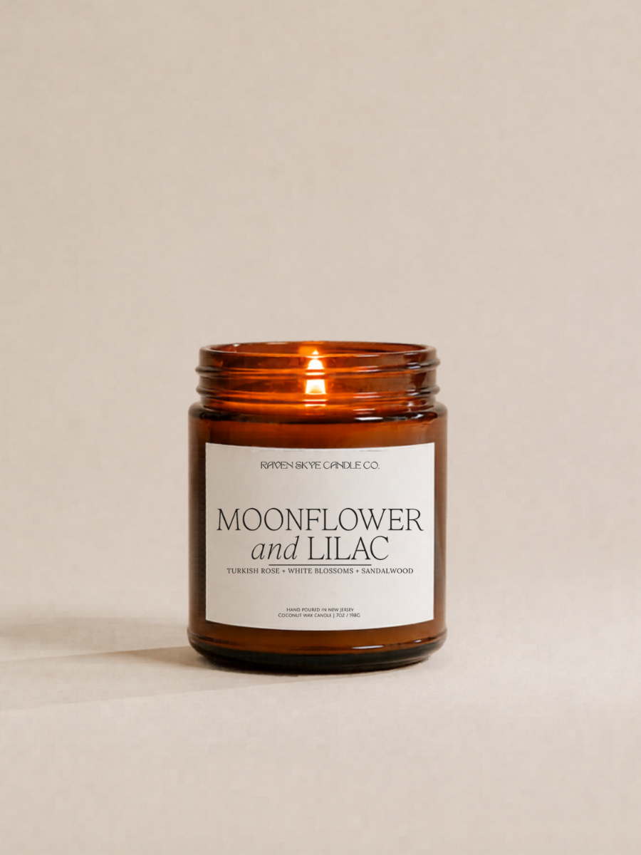 Candle with 'Moonflower and Lilac' label on a beige background